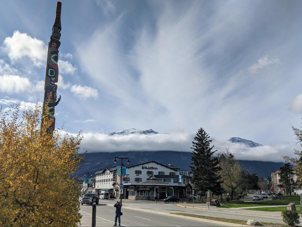 The town of Jasper sits at the base of snow-capped mountains. 