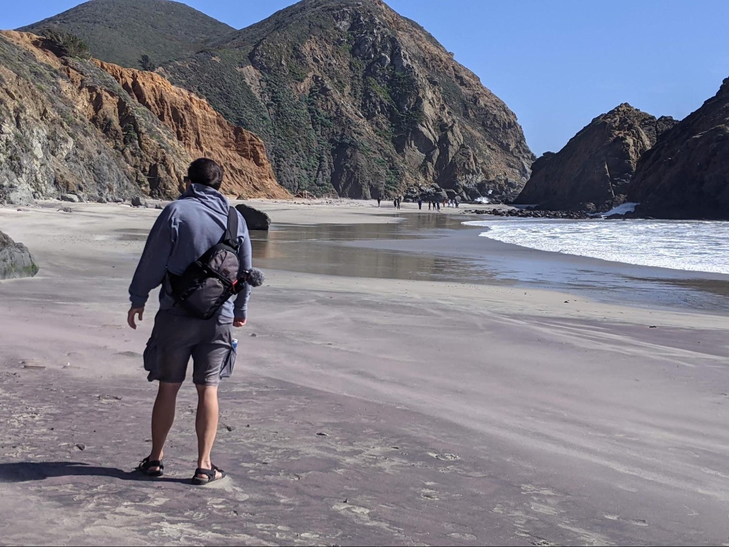 The sand at Pfeiffer beach on the Big Sur Coastline in California is a mix of white, black, and purple sand! 