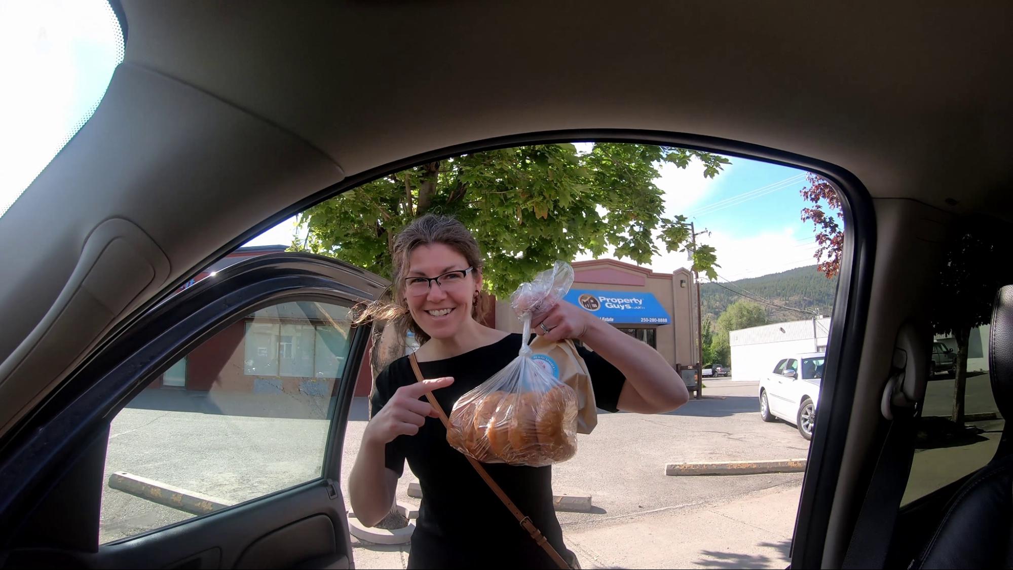 Mel shows the bannock she bought at Kekuli Cafe in Merritt, BC. Our favorite stop there. 